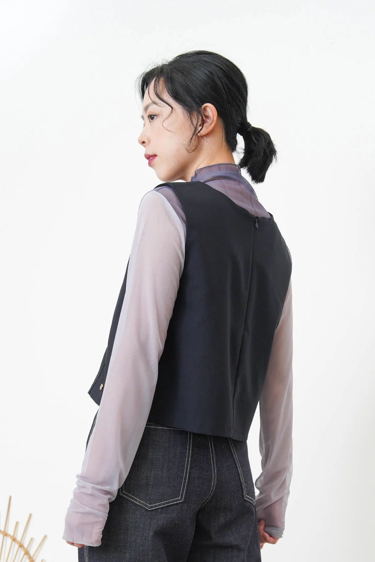 Beige vest w/ badge